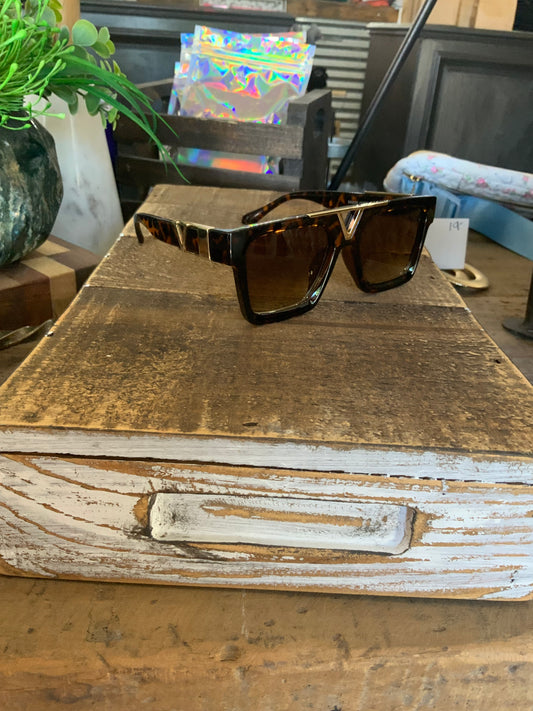 Tort and gold sunglasses
